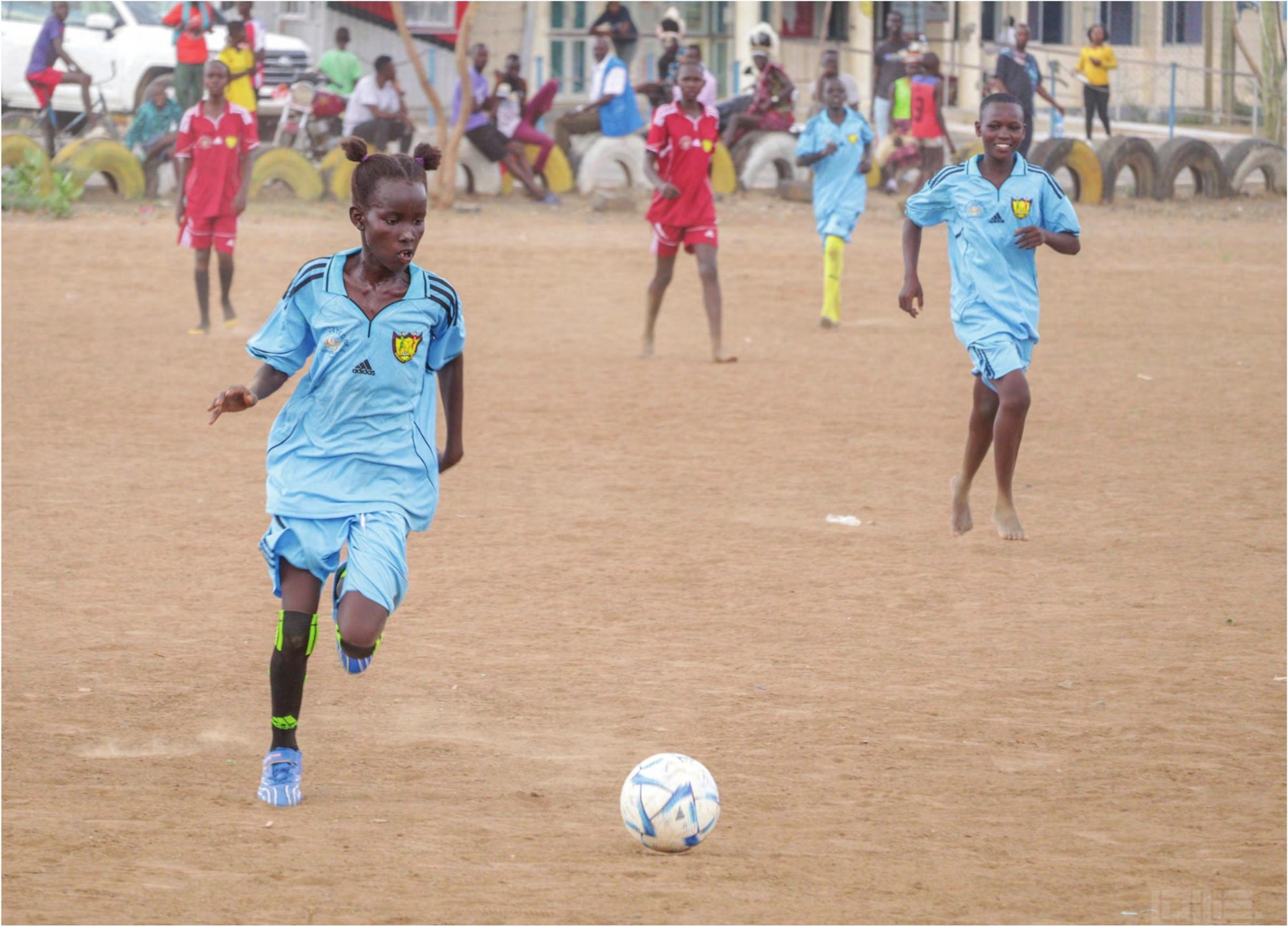Desert Roses players competing for the ball during a football session