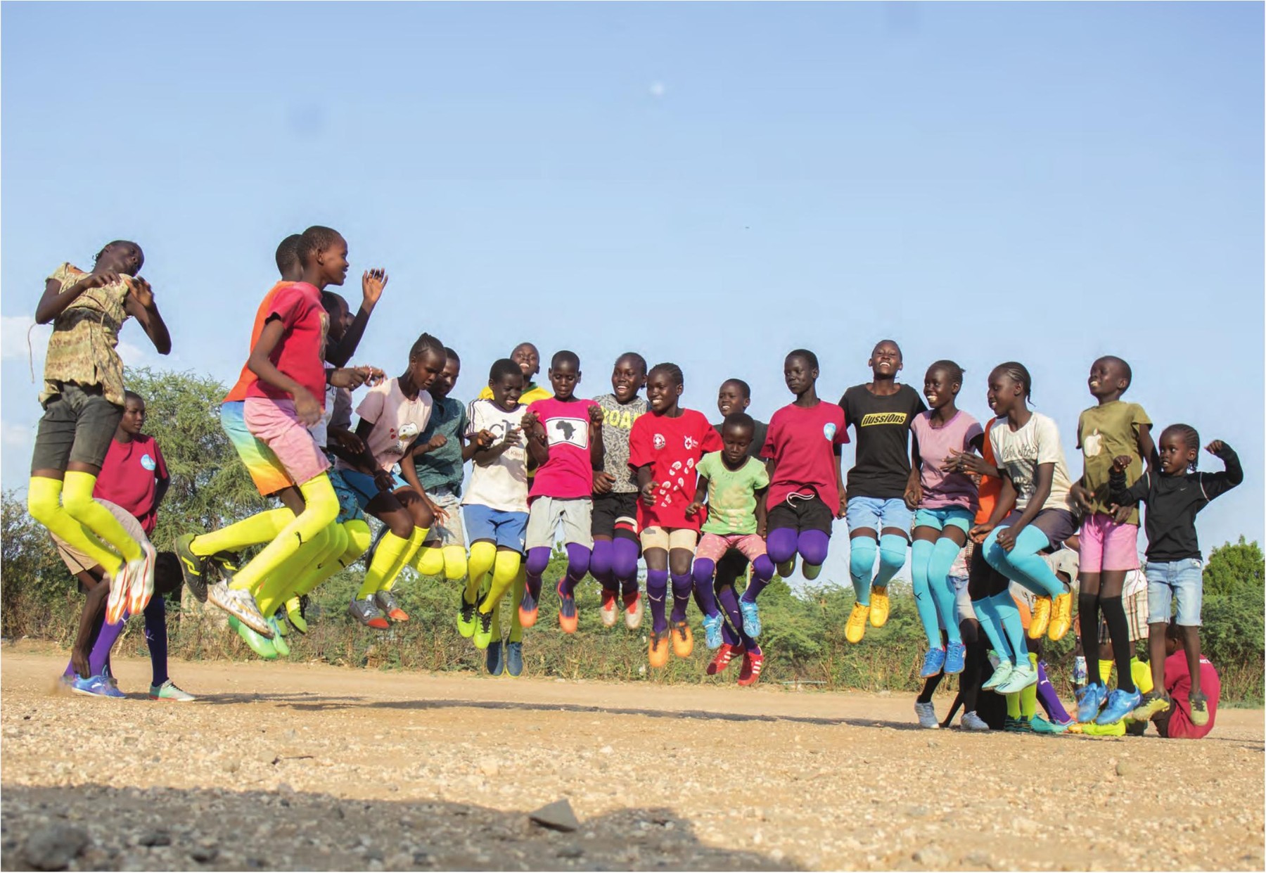 Desert Roses girls jumping together on the pitch